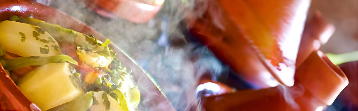 picture of dipping bread into culinary Argan Oil to eat