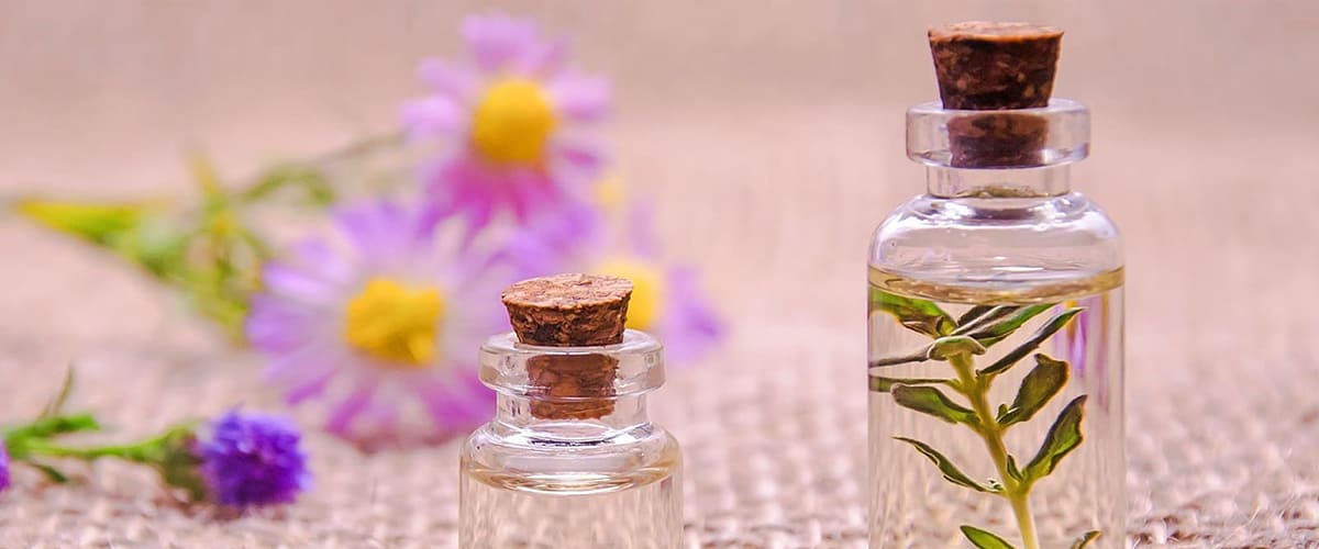table with small coloured bottles of essential oils